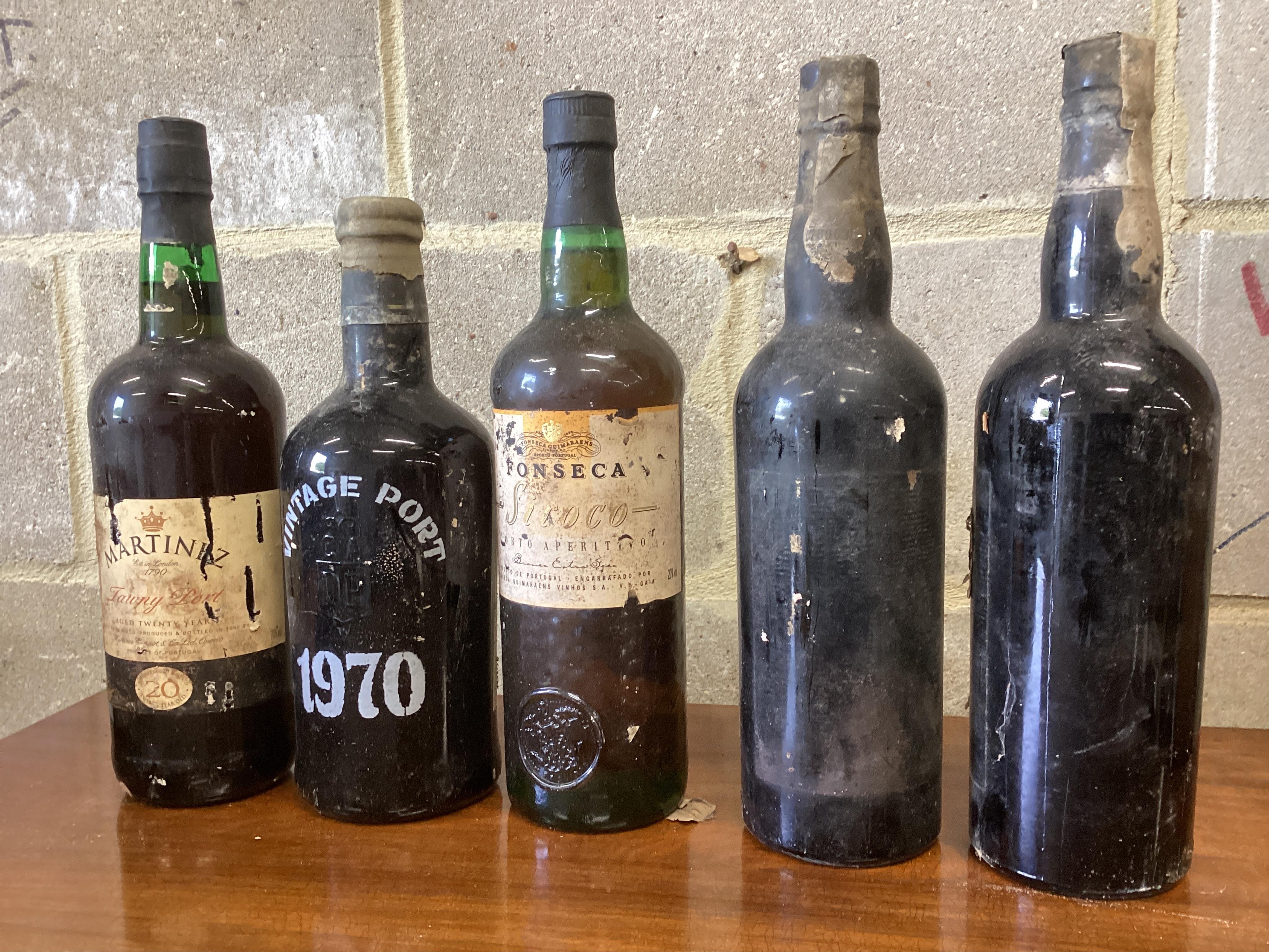 Five bottles of vintage port to include Martinez and Fonseca, two unlabelled. (From a local private cellar). Condition - labels degraded